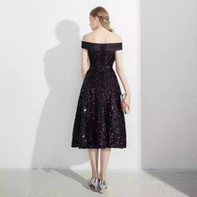 Load image into Gallery viewer, The Prenelia Off Shoulder Black Dress - WeddingConfetti