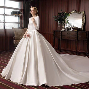 The Pristine Wedding Bridal Satin Long Sleeves Gown - WeddingConfetti