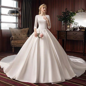 The Pristine Wedding Bridal Satin Long Sleeves Gown - WeddingConfetti