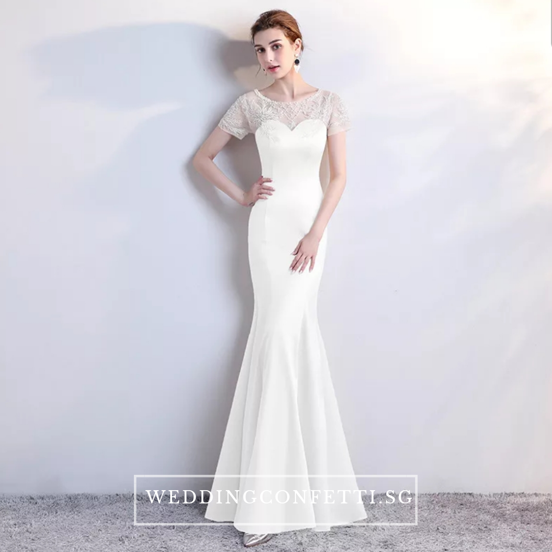 White formal gown with 2025 sleeves