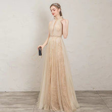 Load image into Gallery viewer, The Penelopia Champagne Halter Gown - WeddingConfetti