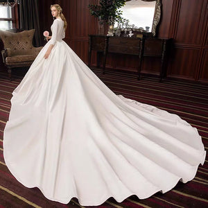 The Pristine Wedding Bridal Satin Long Sleeves Gown - WeddingConfetti