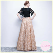 Load image into Gallery viewer, The Charlize Floral Lace Black &amp; Gold Long Sleeves Gown - WeddingConfetti