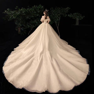 The Serenity Wedding Bridal Off Shoulder Glitter Champagne Gown - WeddingConfetti