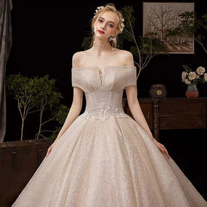 The Fenelee Wedding Bridal Off Shoulder Champagne Gown - WeddingConfetti
