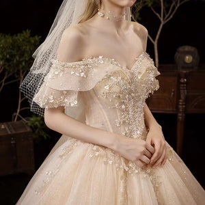 The Serenity Wedding Bridal Off Shoulder Glitter Champagne Gown - WeddingConfetti